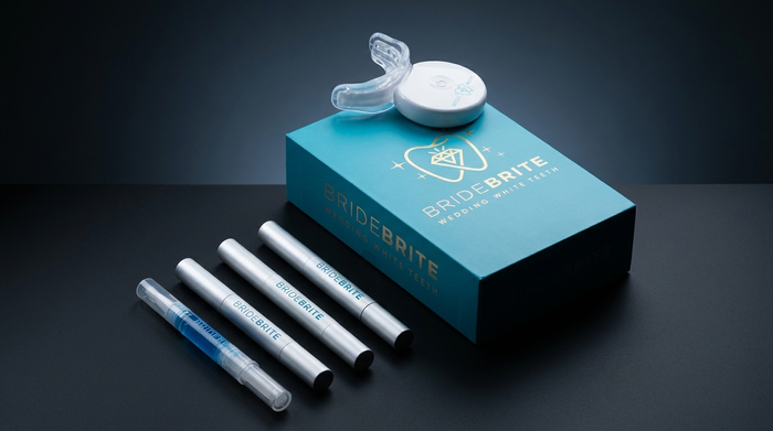 BrideBrite wedding teeth whitening kit with LED mouthpiece and whitening pens on a dark surface