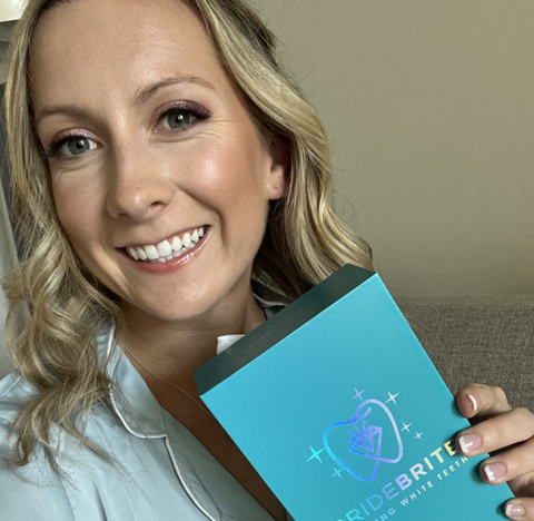 BRITEN customer Mallory M. holding her Bride Brite whitening kit