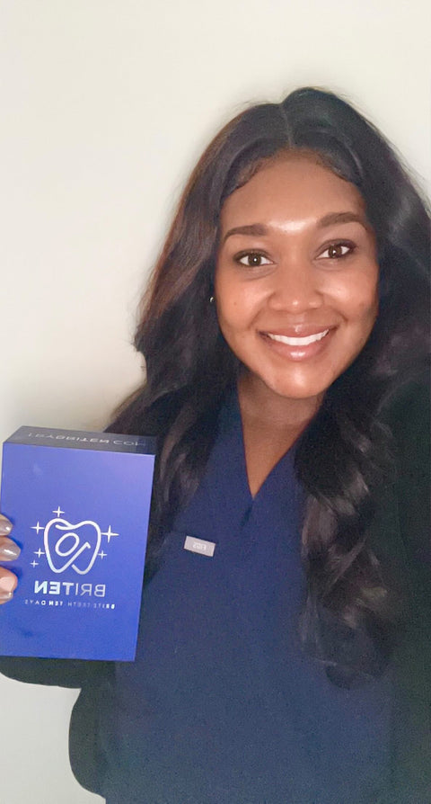Sarah A. registered dental hygienist holding her BRITEN kit