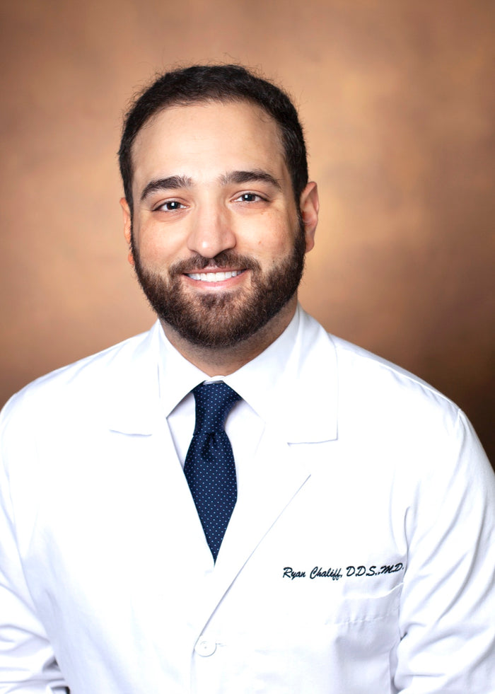 Dr. Ryan Chaliff, DDS, MD, practicing dentist and co-founder of BRITEN, in a white coat